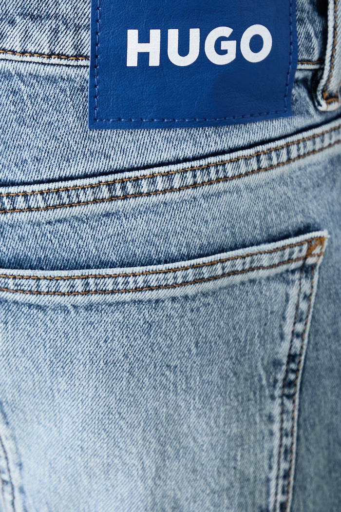 Jeansy tapered męskie Brody HUGO Blue 50567989 niebieski