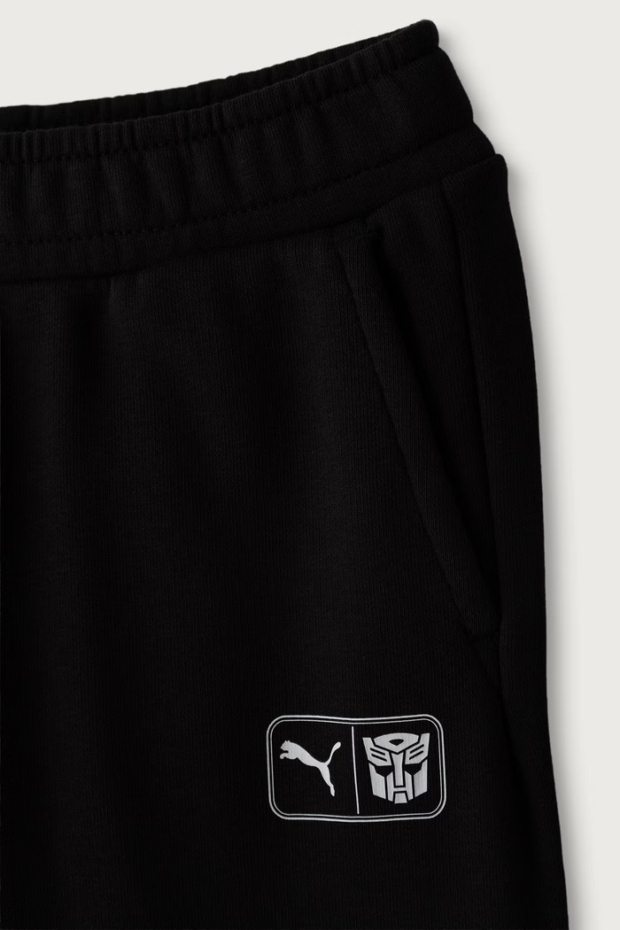 Chłopiec Puma Spodnie dresowe dziecięce z bawełną PUMA X TRANSFORMERS Sweatpants 637629 czarny