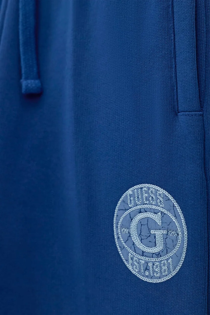 Chłopiec Guess Spodnie dresowe dziecięce bawełniane L6BB04.K6069.9BY2 niebieski