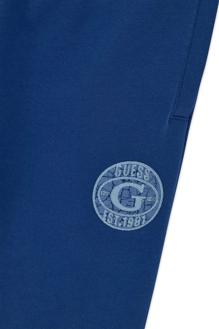 Spodnie dresowe dziecięce bawełniane Guess L6BB04.K6069.9BY2 niebieski