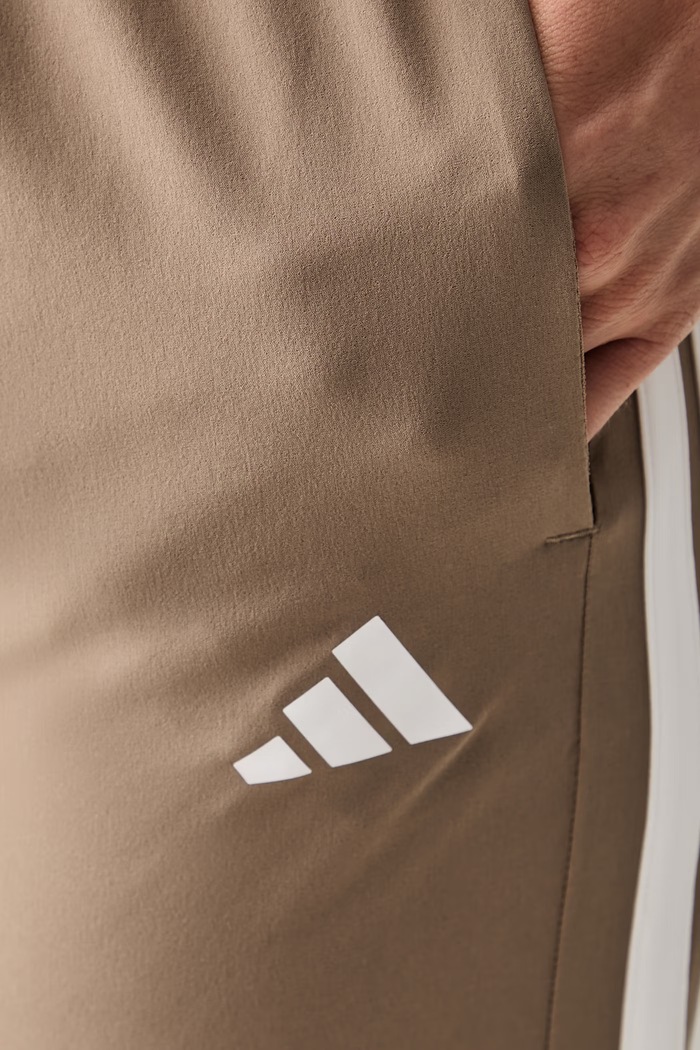 adidas Performance spodnie treningowe damskie Essentials KT3790 beżowy