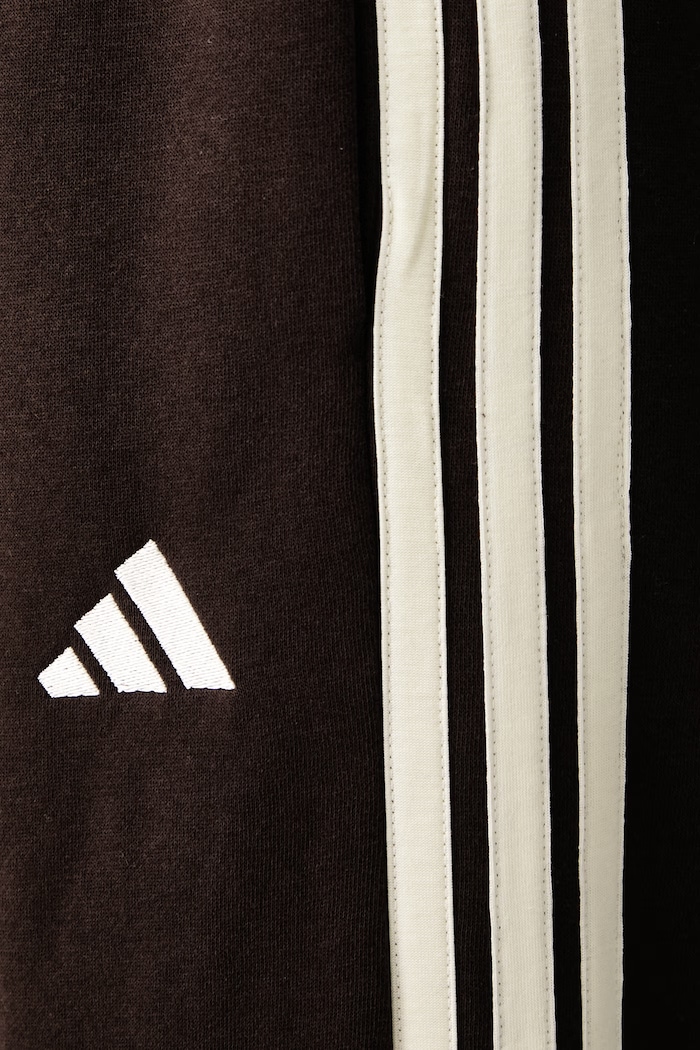 Spodnie dresowe damskie z bawełną Essentials adidas brązowy KX0790