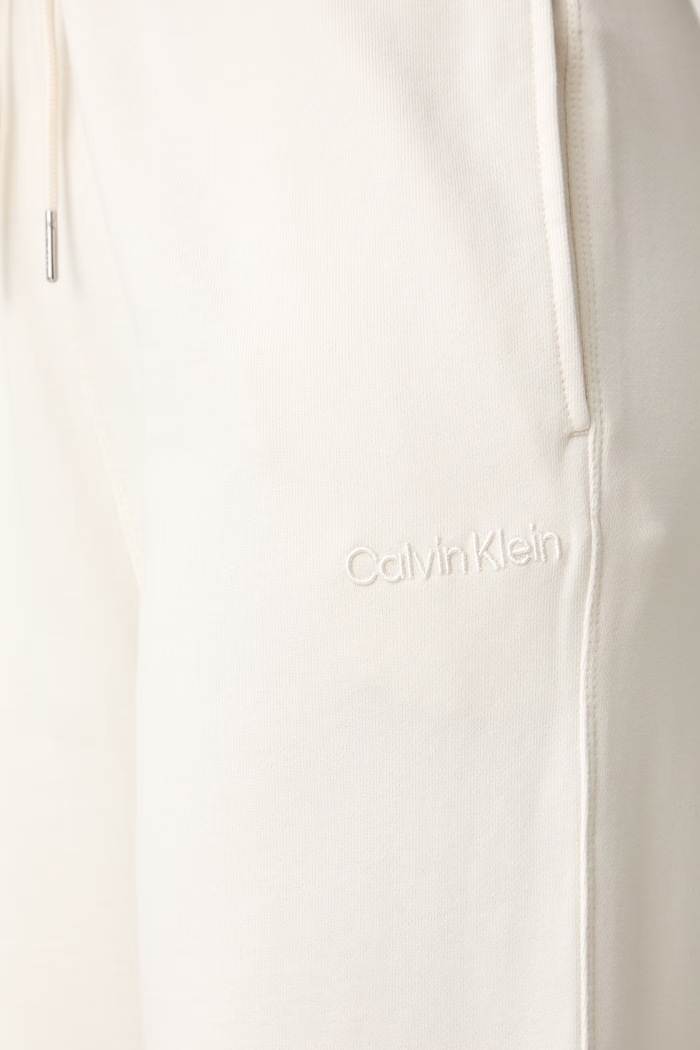 Calvin Klein tepláky dámské bavlněné béžová LV044G248G