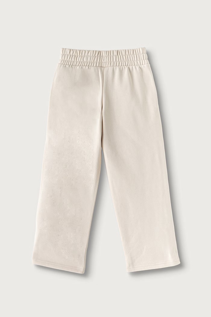 Puma spodnie dresowe dziecięce z bawełną ESS TAPE Relaxed Sweatpants 694959 beżowy AW26