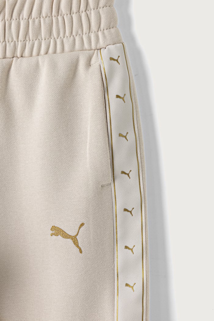 Dziewczynka Puma spodnie dresowe dziecięce z bawełną ESS TAPE Relaxed Sweatpants 694959 beżowy
