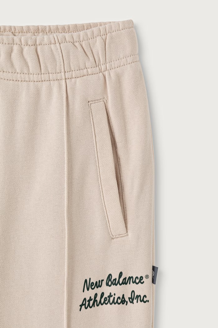 Dziewczynka New Balance Spodnie dresowe dziecięce z bawełną YB62D0N1 beżowy