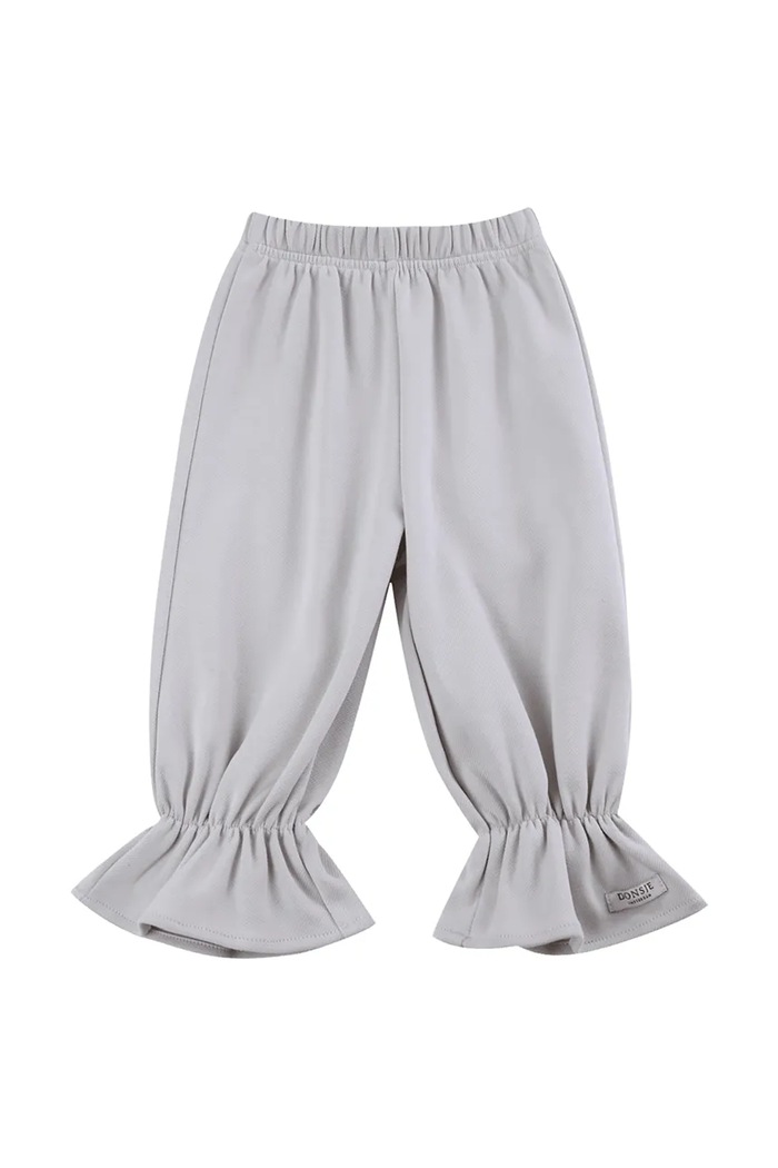 Donsje spodnie dresowe dziecięce bawełniane Lindelwa Trousers 3053200 beżowy AW26