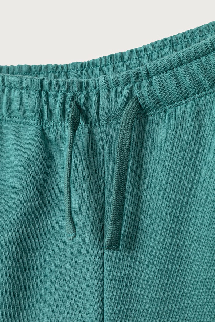 Chłopiec United Colors of Benetton Spodnie dresowe dziecięce bawełniane 3J68CF077.G.Seasonal turkusowy