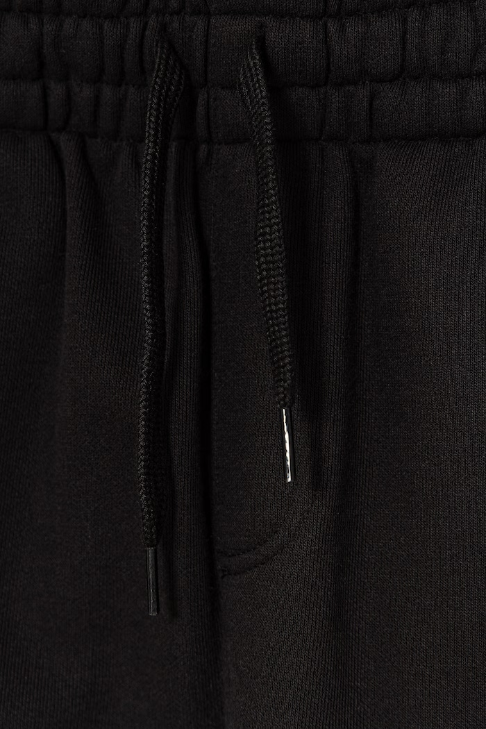 Chłopiec Vans spodnie dresowe dziecięce z bawełną Stretch Logo Sportwear VN000TEGBLK1 czarny