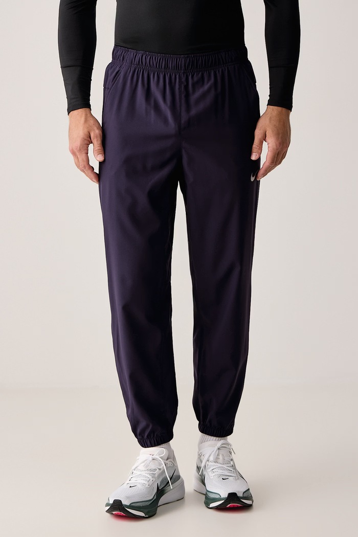Nike Spodnie treningowe męskie Form Dri-FIT fioletowy FB7497.525