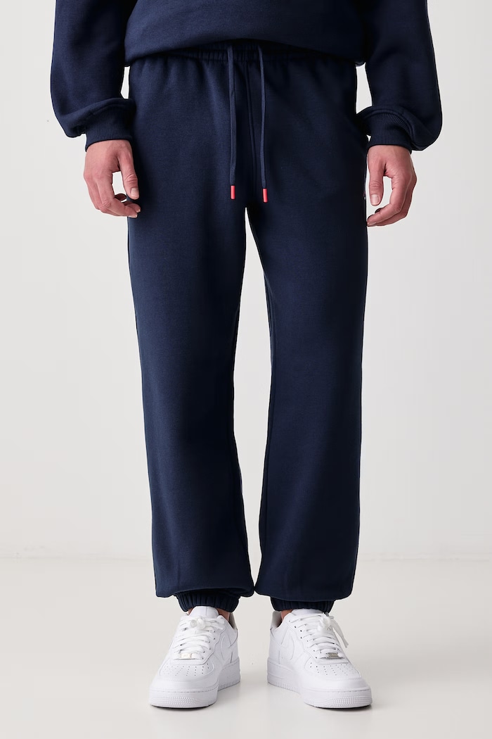Jordan Spodnie dresowe męskie z bawełną Brooklyn Fleece granatowy IM8906.419