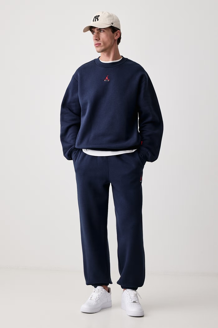 Jordan Spodnie dresowe męskie z bawełną Brooklyn Fleece IM8906.419 granatowy AW26