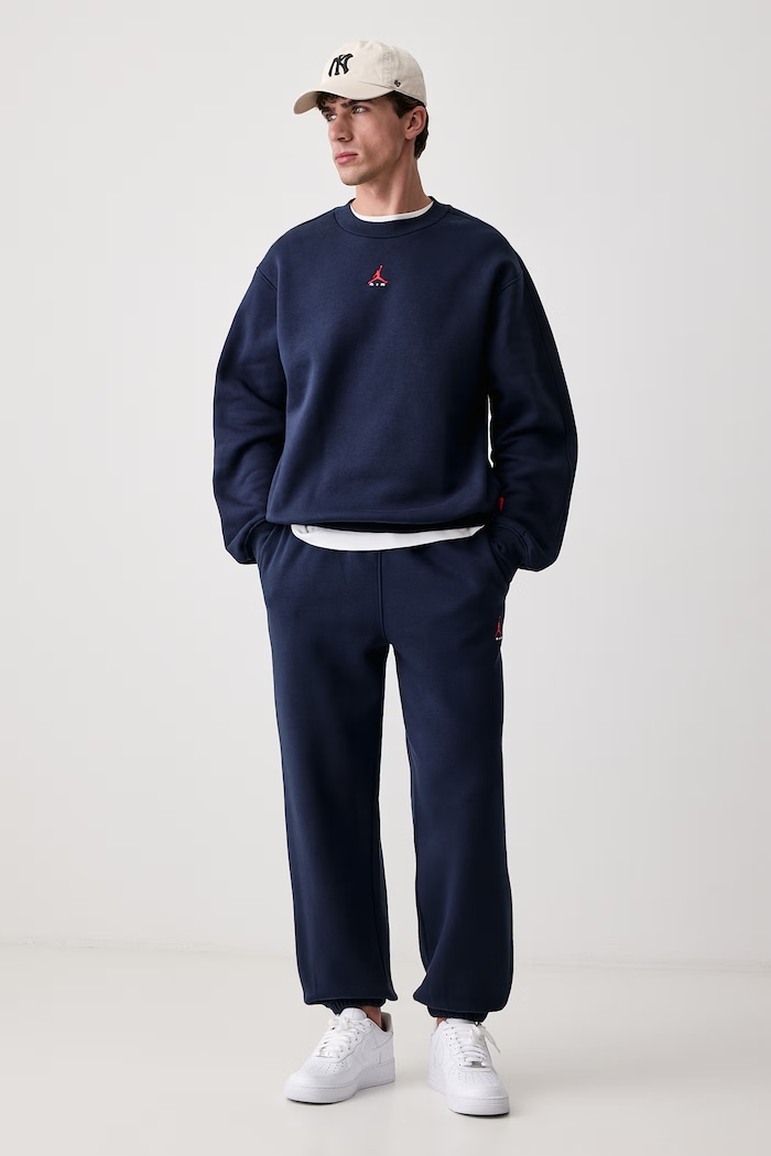 Jordan Spodnie dresowe męskie z bawełną Brooklyn Fleece IM8906.419 granatowy AW26