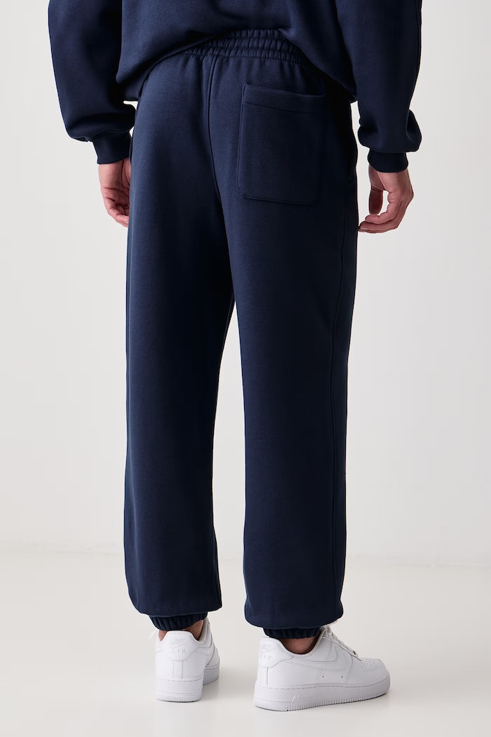 Odzież Jordan Spodnie dresowe męskie z bawełną Brooklyn Fleece IM8906.419 granatowy