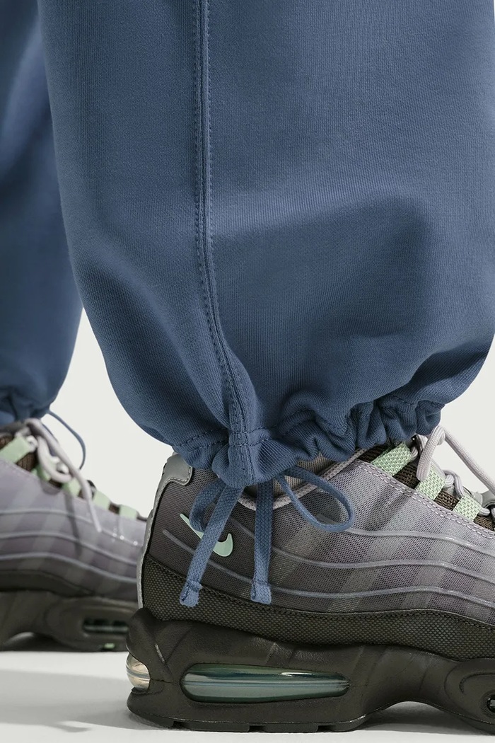 Spodnie dresowe męskie z bawełną Solo Swoosh Nike Sportswear niebieski HV1090.491