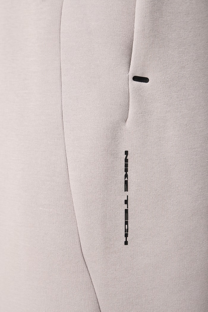 Spodnie dresowe męskie Tech Nike Sportswear beżowy IM6219.009