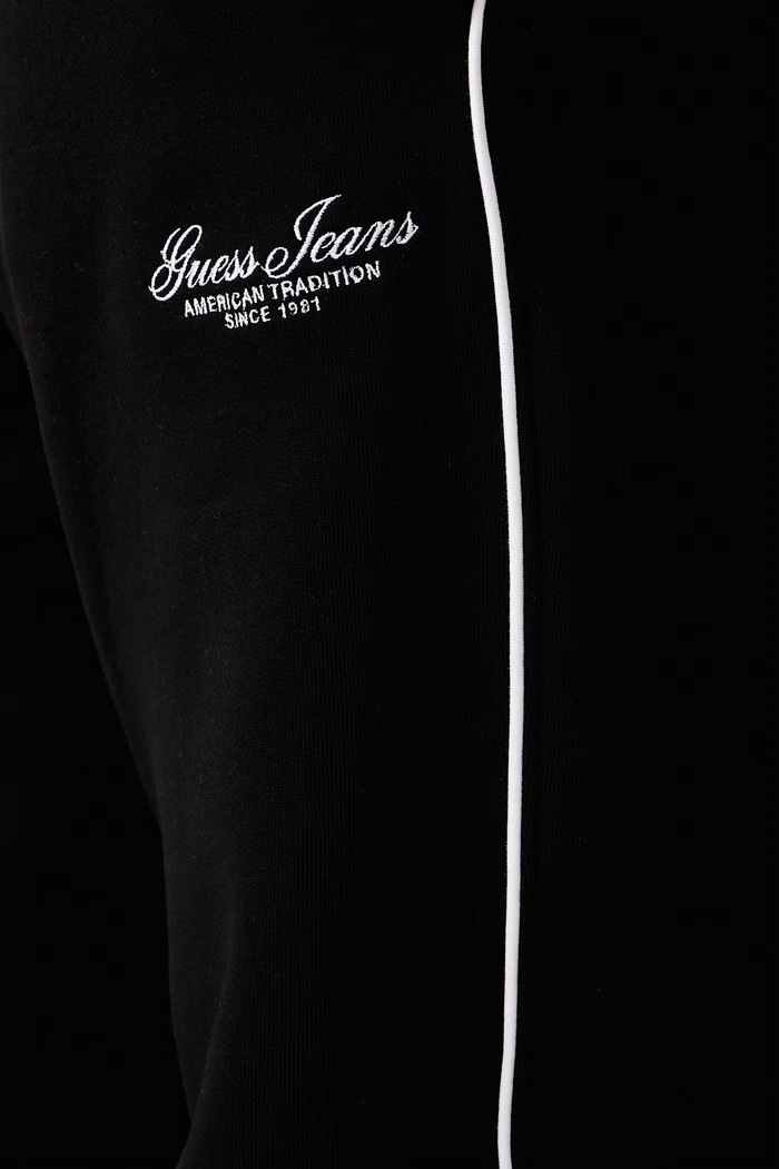 Teplákové nohavice pánske s bavlnou Guess Jeans M6BB19.K6774 čierna