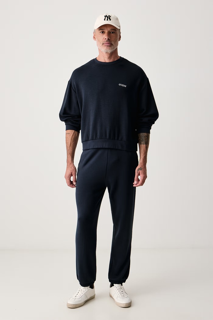 Guess Donji dio trenirke za muškarce s viskozom MARLON U6BB01.K5428 mornarsko plava AW26