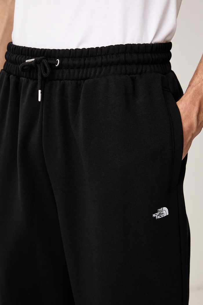 Spodnie dresowe męskie z bawełną Essential The North Face NF0A8JBBJK31 czarny