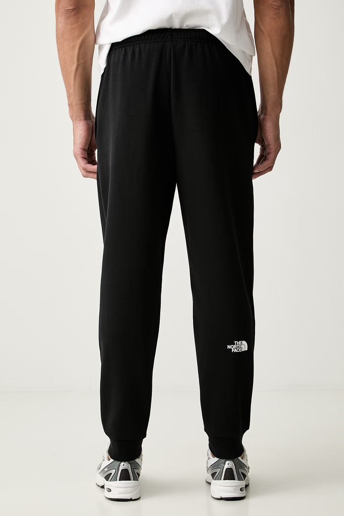 Odzież The North Face spodnie dresowe męskie z bawełną NF0A8JB0JK31 czarny