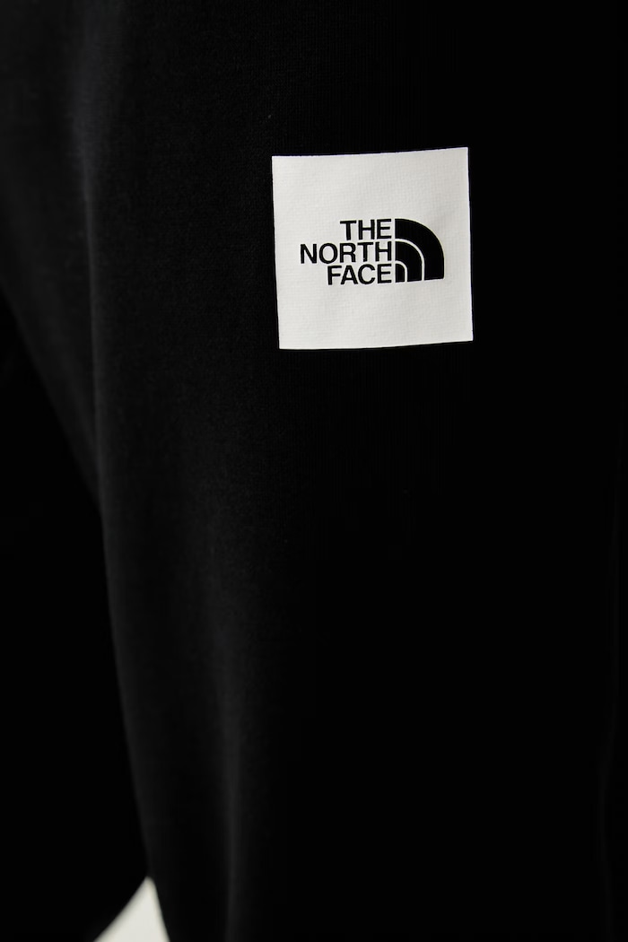 The North Face spodnie dresowe męskie z bawełną czarny NF0A8JB0JK31