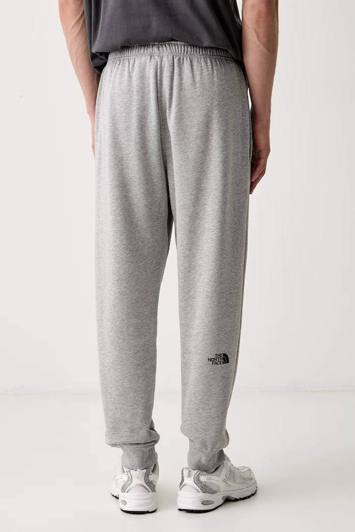 Odzież The North Face Spodnie dresowe męskie z bawełną NF0A8JB0CQO1 szary