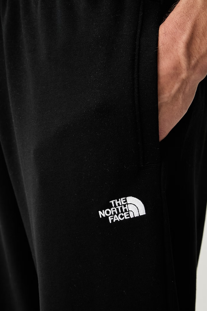 The North Face spodnie dresowe męskie z bawełną Essential czarny NF0A8FDFJK31