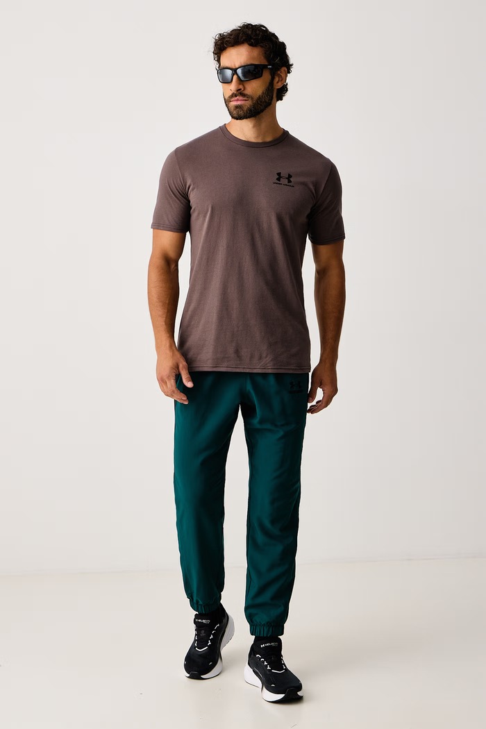 Under Armour Spodnie treningowe męskie Tech Sport 6011268.919 zielony AW26