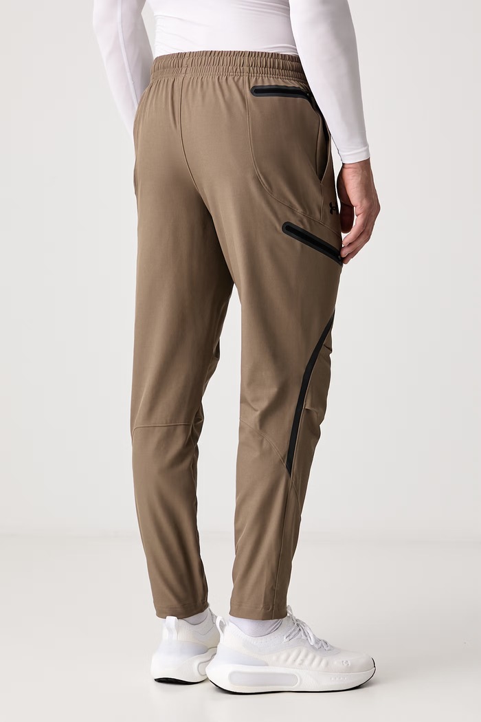 Odzież Under Armour Spodnie dresowe męskie Unstoppable 1390256.219 zielony