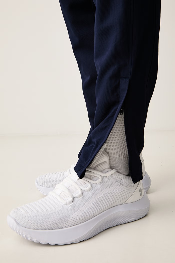Spodnie dresowe męskie Under Armour 1390150.410 granatowy
