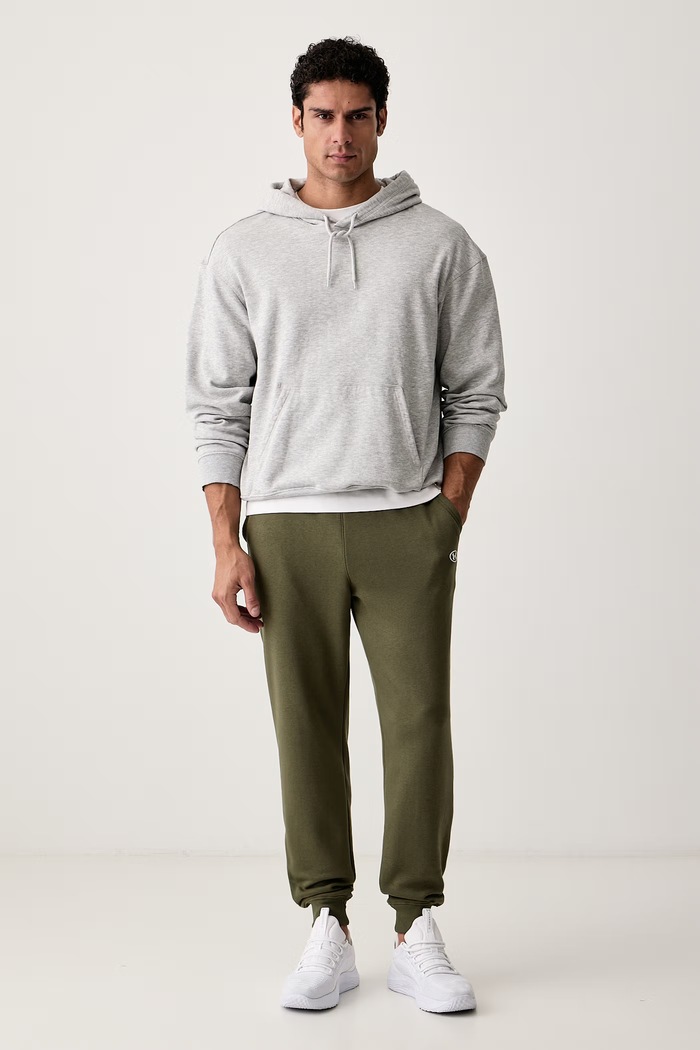 Under Armour Spodnie dresowe męskie z bawełną Rival 6017021 zielony AW26