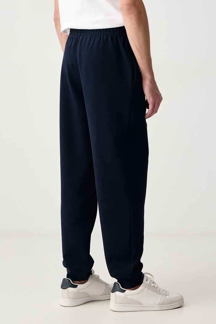 Odzież Lacoste Spodnie dresowe męskie z bawełną XH9455 granatowy