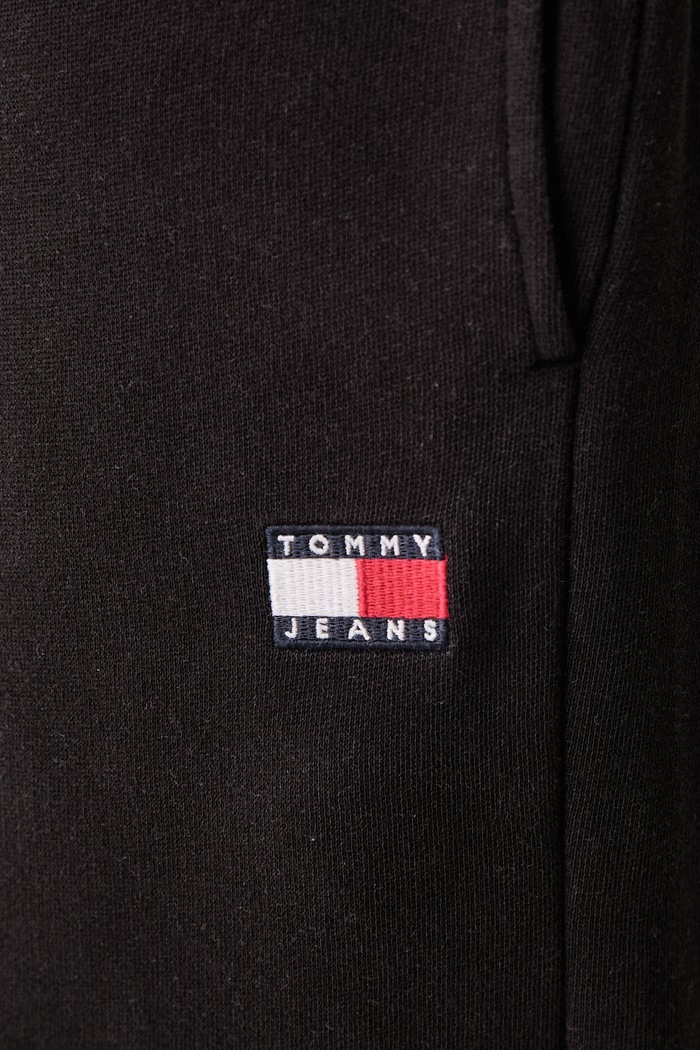 Tepláky pánské s bavlnou Tommy Jeans DM0DM23729 černá