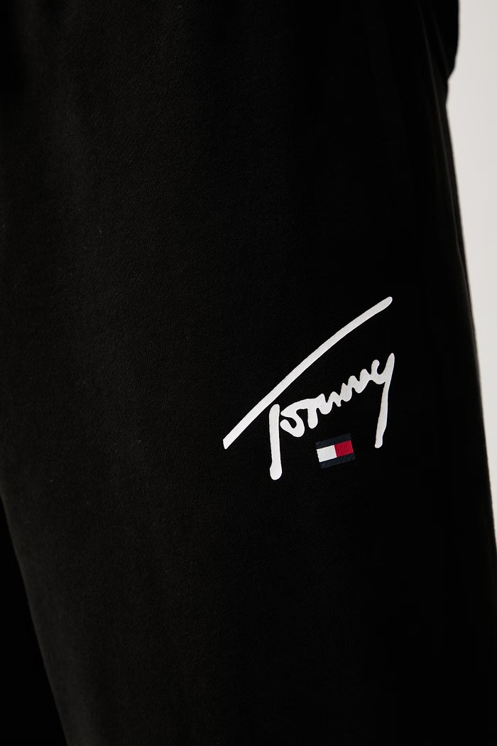 Tommy Jeans tepláky pánské bavlněné černá DM0DM23593