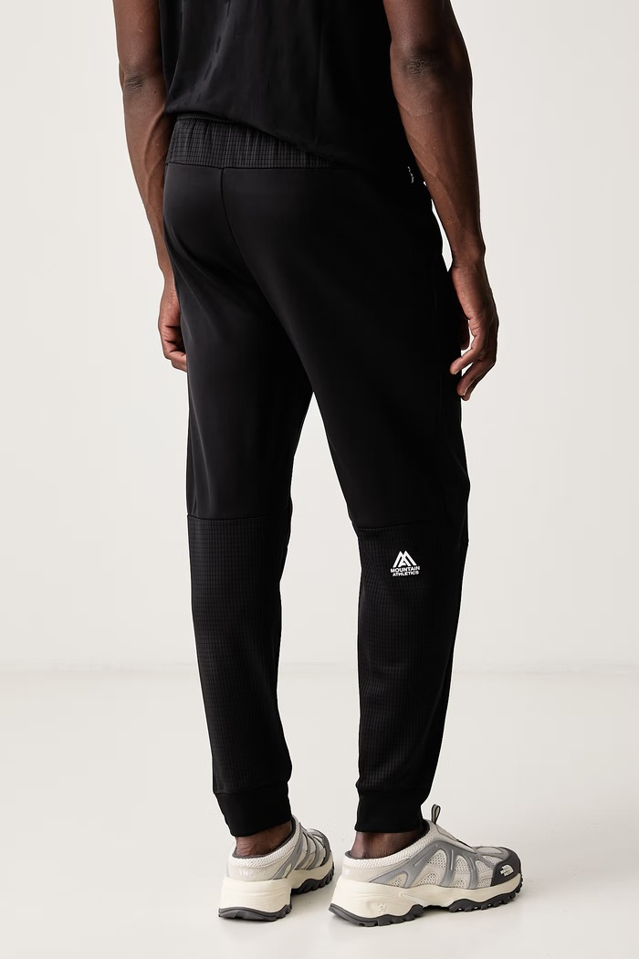 Ρούχα The North Face Παντελόνι προπόνησης Ανδρικό MOUNTAIN ATHLETICS NF0A8J8DJK31 μαύρο