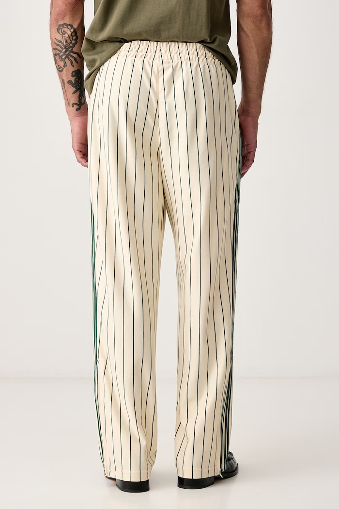 Odzież adidas Originals Spodnie dresowe męskie Firebird Pinstripes KT4300 beżowy
