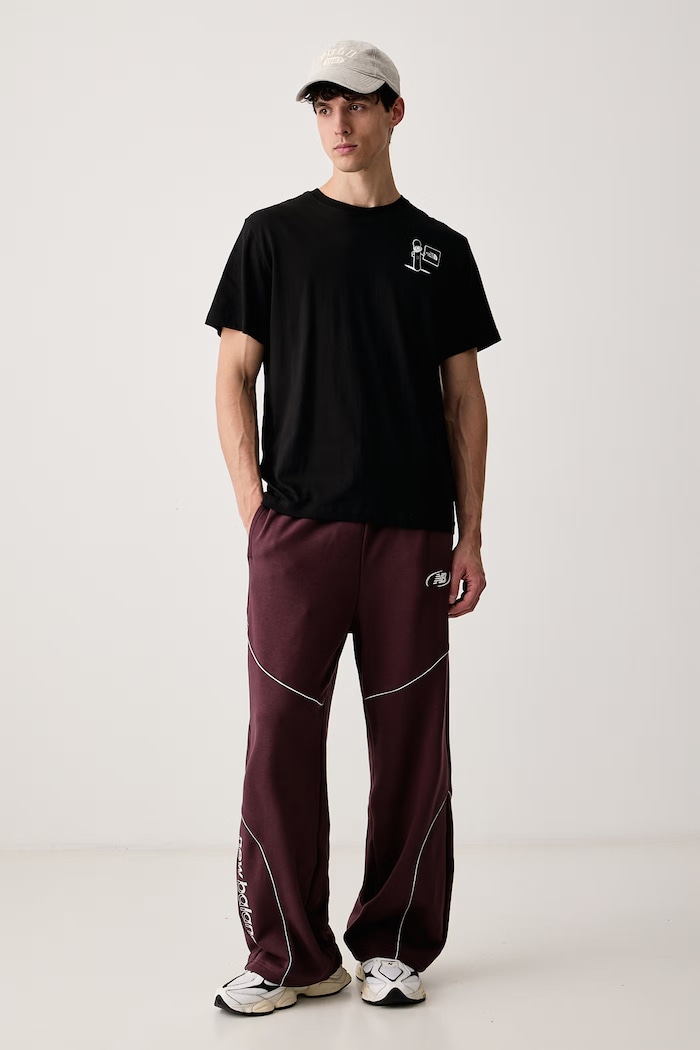 New Balance Spodnie dresowe męskie z bawełną MB62053FYLR bordowy AW26