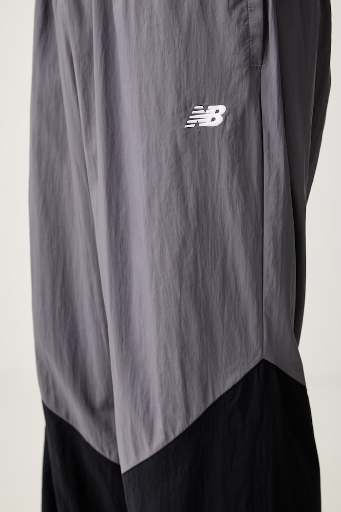 New Balance spodnie dresowe męskie fioletowy MB61R010AA9