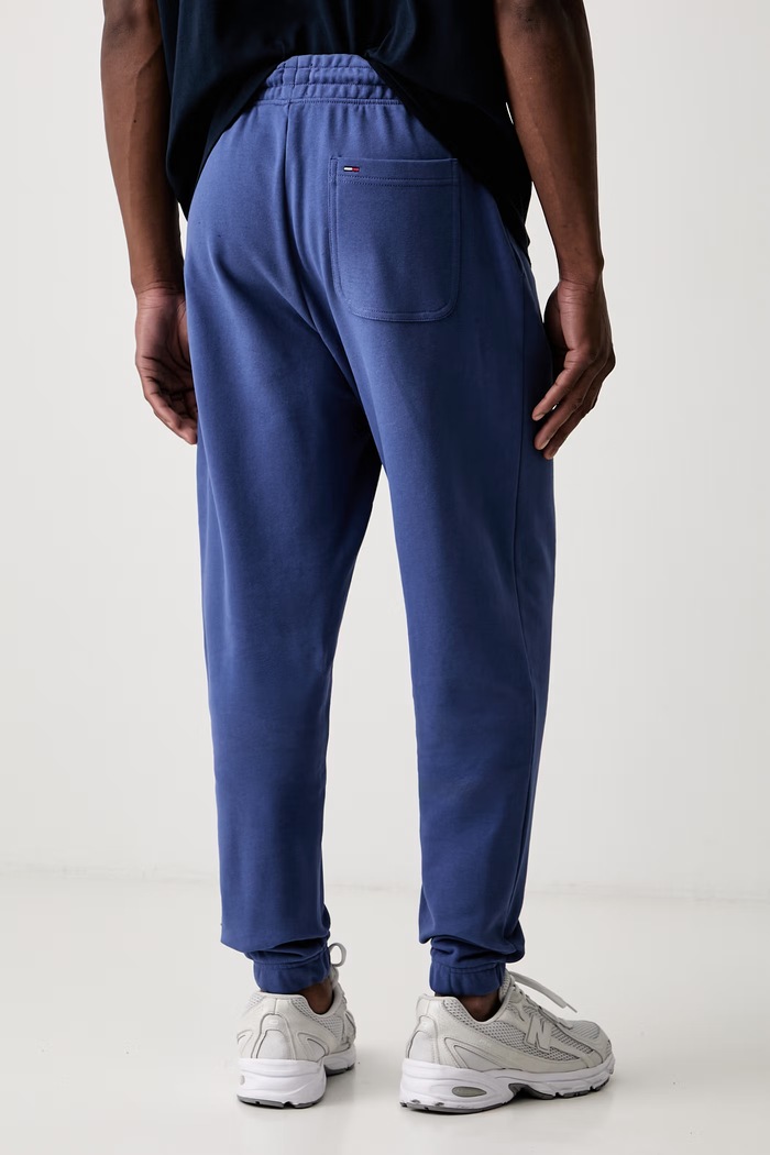 Odzież Tommy Jeans spodnie dresowe męskie bawełniane DM0DM23903 niebieski
