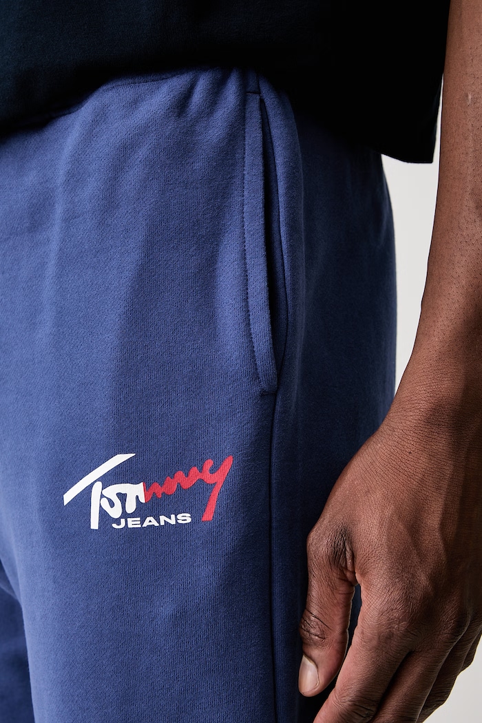 Tommy Jeans spodnie dresowe męskie bawełniane niebieski DM0DM23903