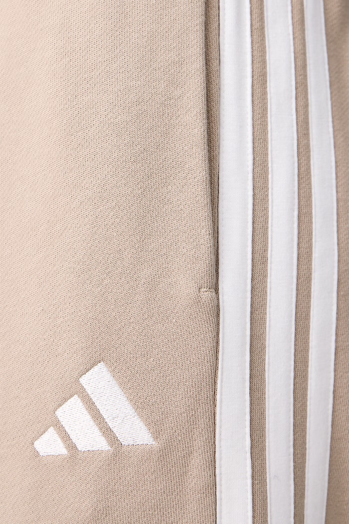 Spodnie dresowe męskie bawełniane Essentials adidas beżowy KY4196