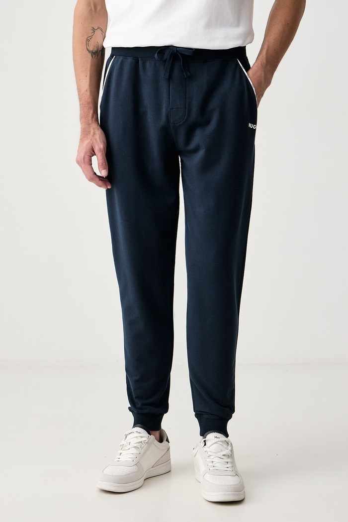 HUGO Nohavice loungewear pánske s bavlnou NOAH PANTS tmavomodrá 50566158