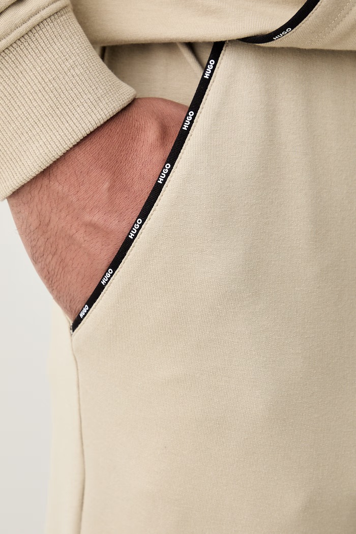 HUGO loungwear hlače za muškarce s pamukom NOAH PANTS bež 50566158