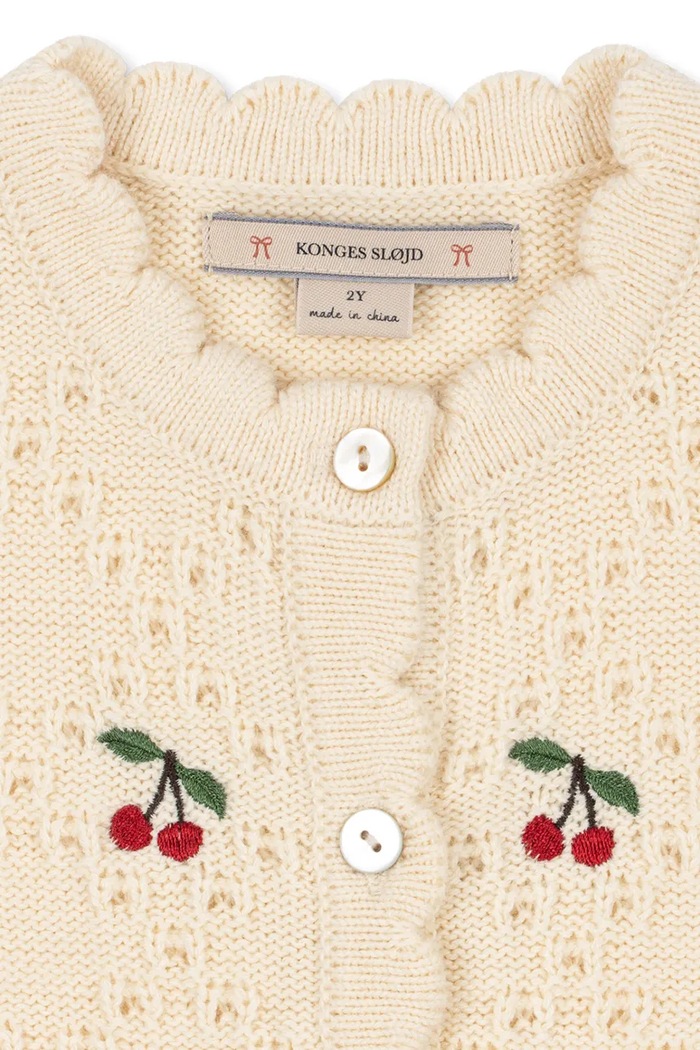Кардиган для детей из шерсти COCOLO CARDIGAN Konges Sløjd KS105949.9BY2 бежевый