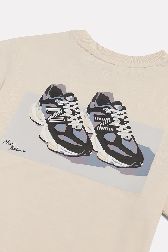 Dziewczynka New Balance T-shirt dziecięcy bawełniany YT62J1FR beżowy
