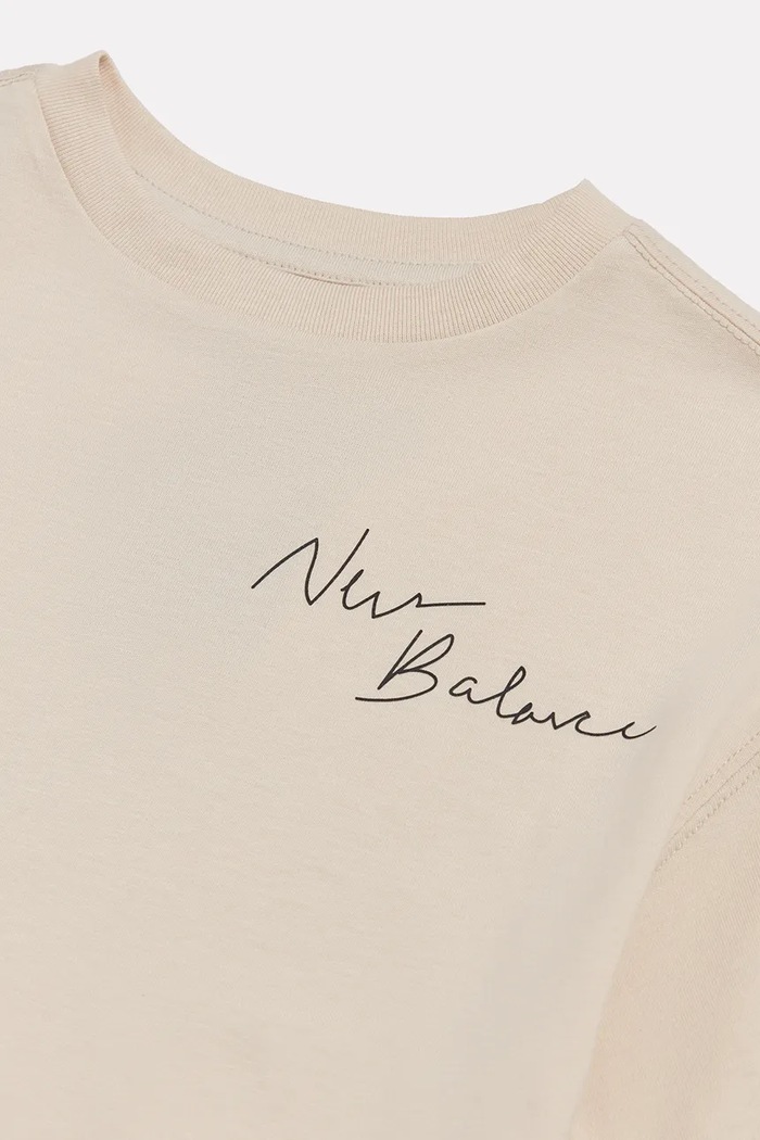 T-shirt dziecięcy bawełniany New Balance YT62J1FR beżowy