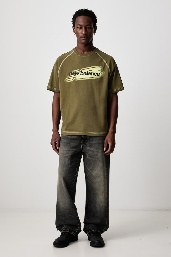 New Balance T-shirt oversize bawełniany męski MT62T1JVAAO zielony AW26