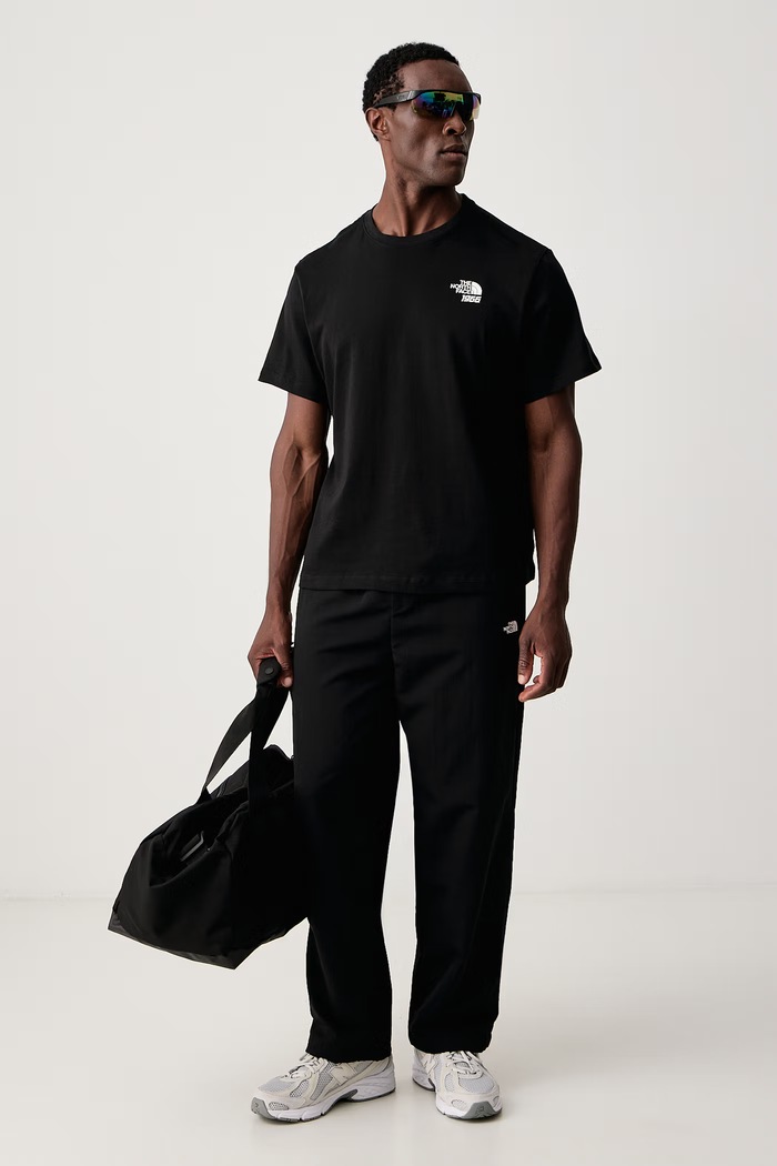 The North Face Tričko pánske bavlnené Anniversary NF0A8H69JK31 čierna AW26