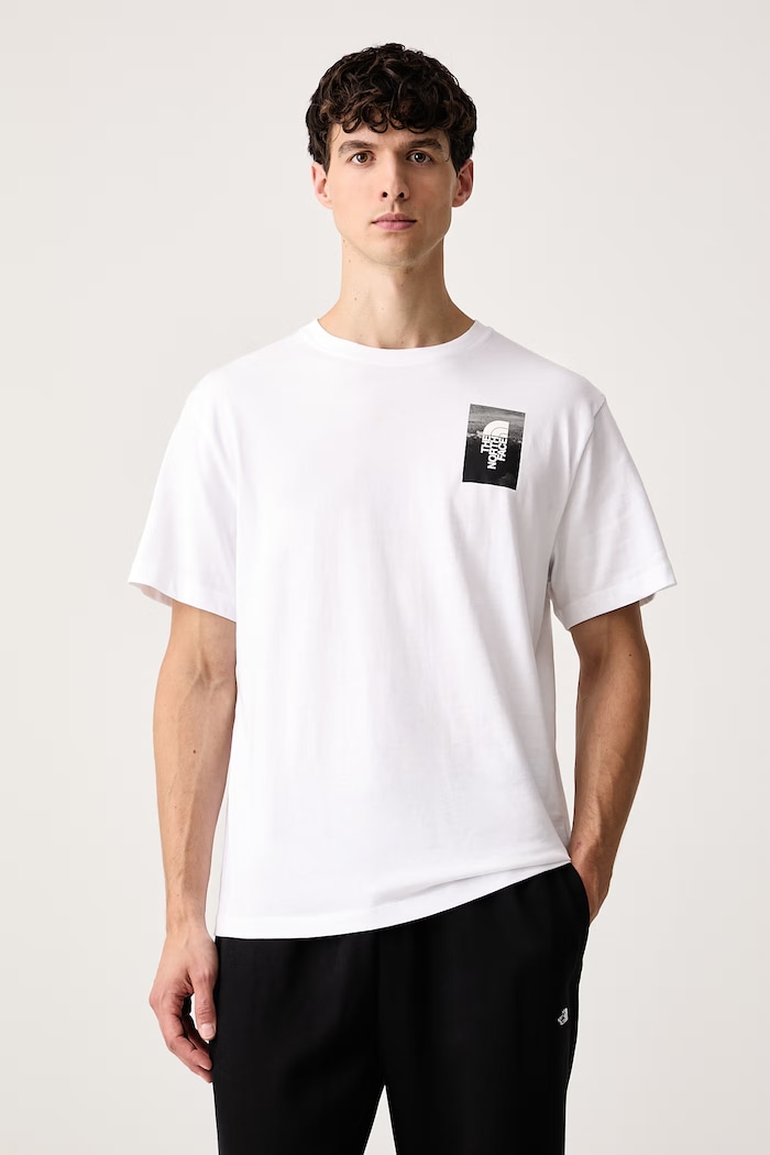 Ρούχα The North Face T-shirt ανδρικό βαμβακερό Collage Relaxed NF0A8H5KFN41 λευκό