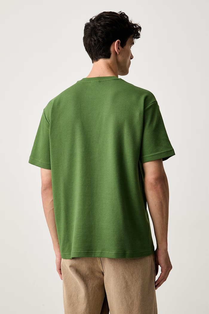 Odzież Puma T-shirt męski z bawełną Essentials Elevated 694307 zielony